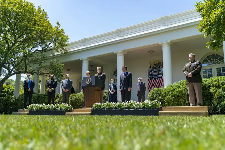 Gen. Gustave Perna, in uniform at right, stands in the Rose Garden as Operation Warp Speed is launched, 15 May 2020.