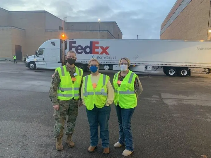 Operation Warp Speed’s Col. Mike Post and Marion Whicker check the first Pfizer vaccine shipment as it loads onto FedEx and UPS trucks, December 2020.