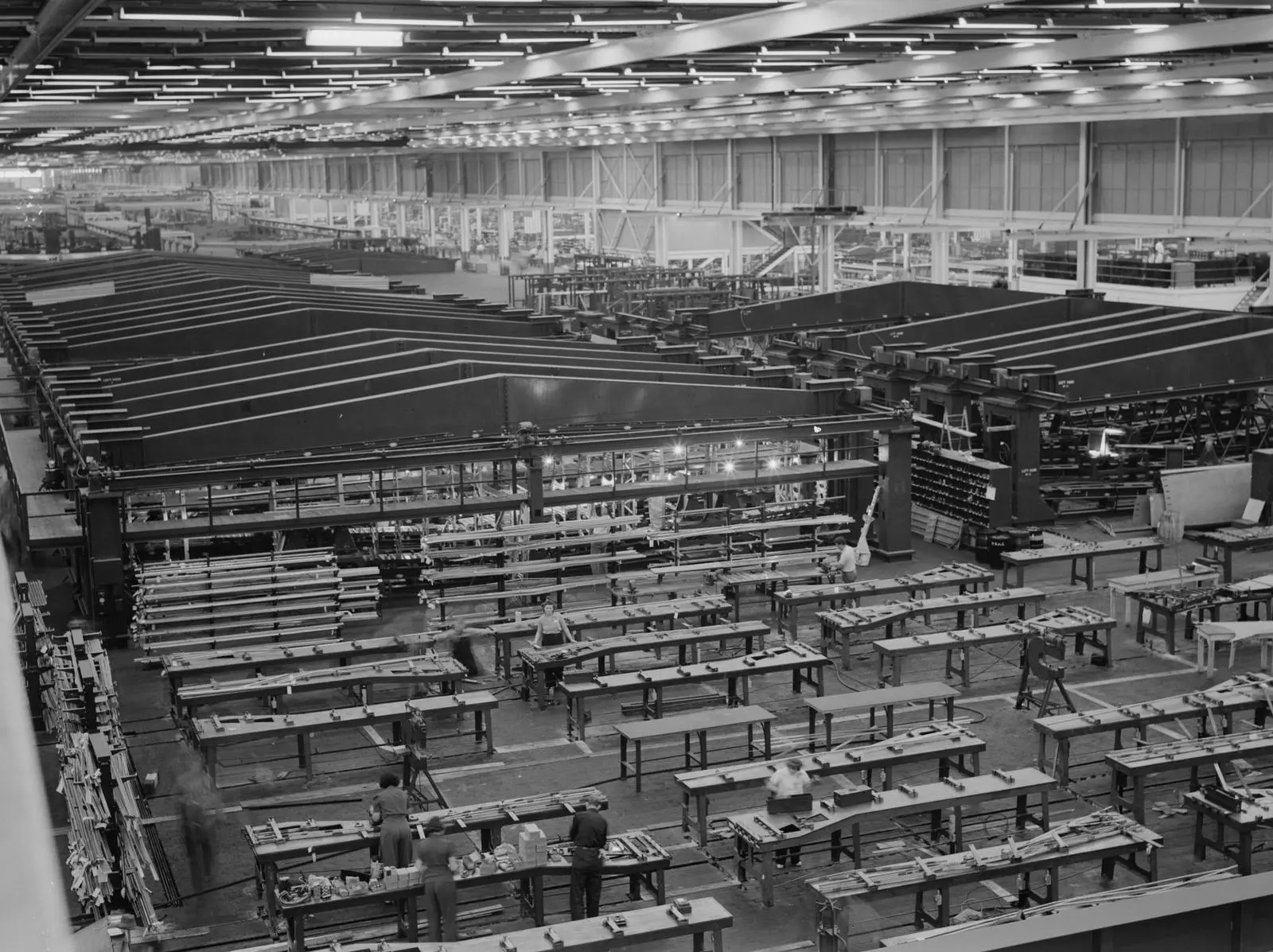 A small part of the world’s largest one-story war plant: fixtures for bomber wings stretch across the Willow Run floor, July 1942